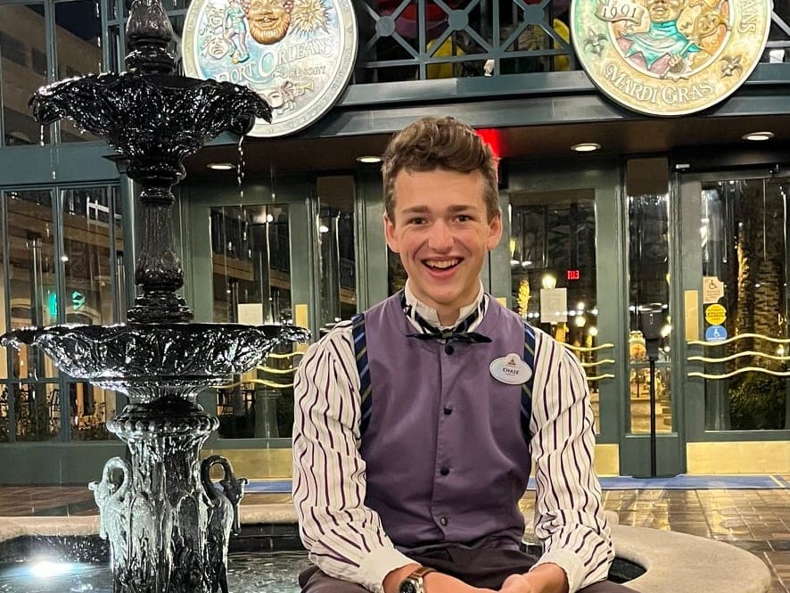 Chase in his Port Orleans French Quarter costume beside the lobby fountain